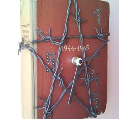 Barbed wire star wall clock from warlike historical book