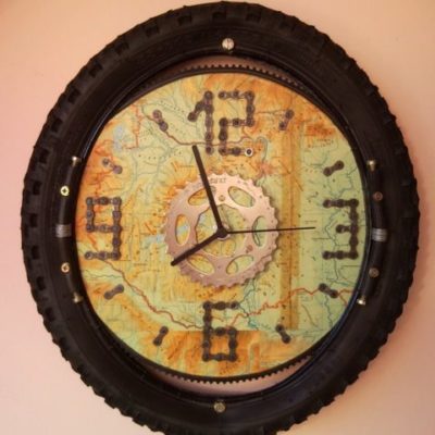Recycled bicycle wheel wall clock with map for bikers