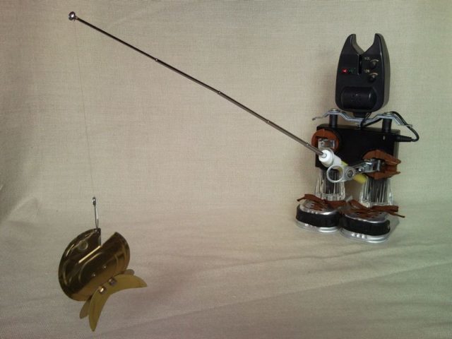 Fisherman catch the goldfish, upcycled sculpture from bite indicator