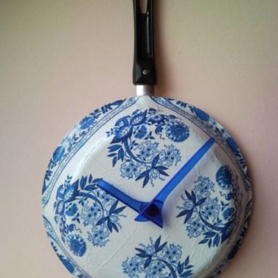 Upcycled wall clock from griddle, frying pan with decoupaged flowers 1.