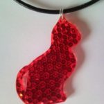 Red Tom-cat necklace, pendant from retro-reflector