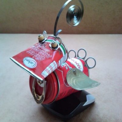 Recycled tomato red Bird of Paradise sits in phone charger nest