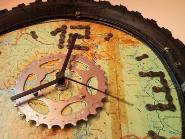 Recycled bicycle wheel wall clock with map for bikers