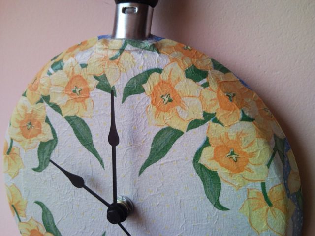Upcycled wall clock from griddle, frying pan with decoupaged flowers 3.