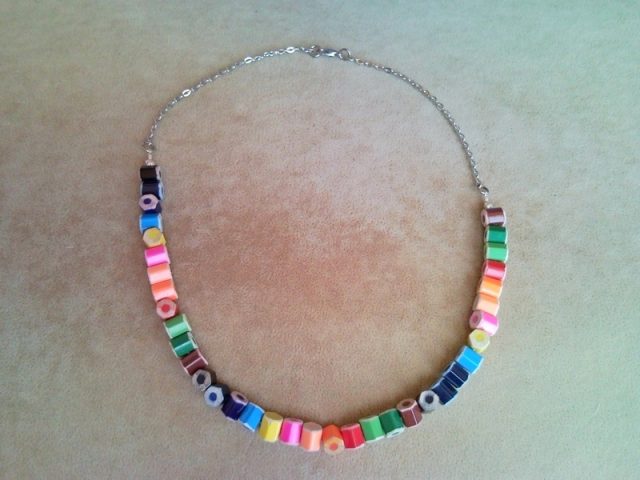 Rainbow style colored pencil necklace on silver colored chains